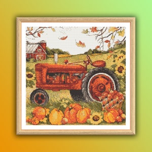 May include: A red tractor with a basket of pumpkins and gourds in front of it. The tractor is in a field with a red barn in the background.