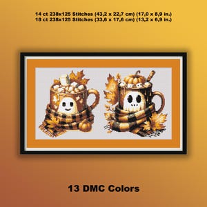 May include: Cross-stitch artwork featuring two mugs with Halloween themes. One mug has a ghost face, the other a skull. Both are wrapped in scarves and decorated with fall leaves and pumpkins. The text reads "13 DMC Colors".