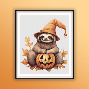 May include: A brown sloth wearing a witch's hat sits on a jack-o'-lantern with autumn leaves around it.
