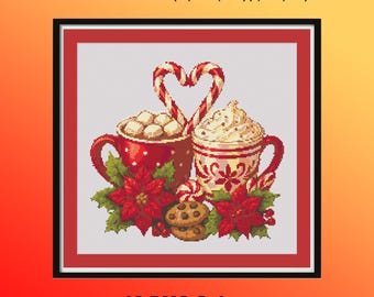 May include: Cross-stitch design featuring two mugs of hot chocolate with whipped cream, candy canes, cookies, and poinsettias. The text reads "14 ct 160x148 Stitches (11.4 x 10.6 in.)" and "18 ct 160x148 Stitches (8.9 x 8.2 in.)". The design uses 16 DMC colors.