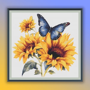 May include: A blue butterfly with black markings rests on a bouquet of yellow sunflowers with brown centres. The sunflowers have green stems and leaves.