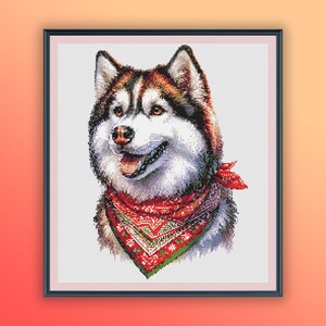 May include: A white and brown husky dog with black eyes and a red bandana with white snowflakes around its neck. The dog is looking to the right of the image.
