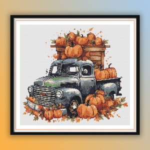 Puede incluir: Impresión digital de una camioneta gris vintage desbordante de calabazas naranjas. La caja y la cabina de la camioneta están llenas de calabazas, rodeadas de hojas de otoño. La obra de arte está sobre un fondo blanco.