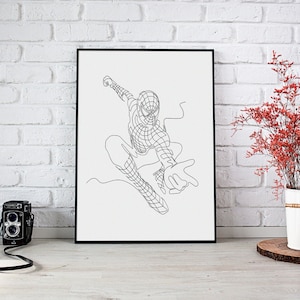 Könnte beinhalten: Ein schwarzer gerahmter Druck einer Linienzeichnung von Spider-Man in einer Web-Schwing-Pose. Der Druck ist auf weißem Hintergrund und hängt an einer weißen Backsteinwand.