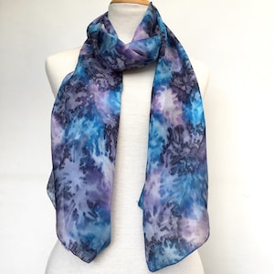 Long silk scarf in vivid stormy blues. Light weight, a generous 180cm (72&quot;) long, hand-painted in dark blue, pale blue and purple tones.