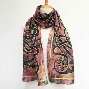 Hand-painted long Celtic silk scarf. In soft autum brown with sage green or in a dark pink with an all-over gold and black Celtic print.