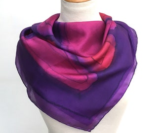 Stunning purple and rich pink square scarf in pure silk. Hand-painted with hand-rolled edges. A generous 90cm square.