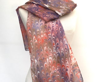 Long marbled oil-effect silk scarf in swirling browns, grey and soft reds.