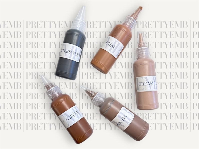 May include: Five small bottles of liquid paint with labels that read "Buttersweet", "Chai", "Cream", "Toffee", and "Mocha".