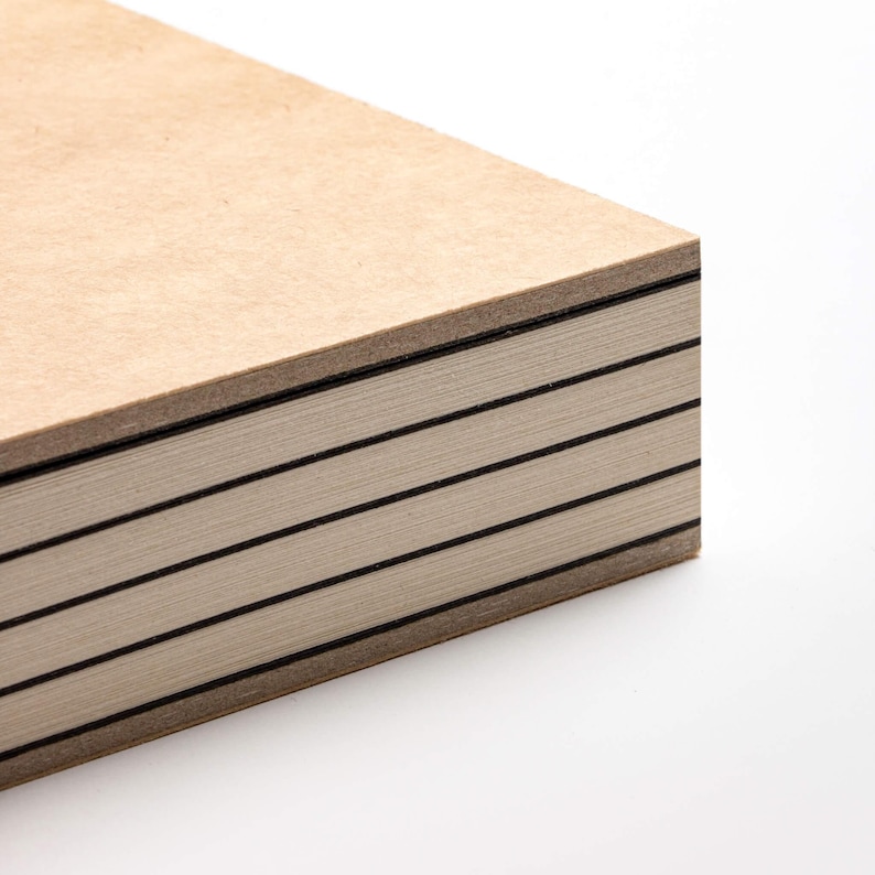 basenotes 2333 sketchbook with kraft cover showing exposed spine and alternating black dividers, crafted with precision binding.