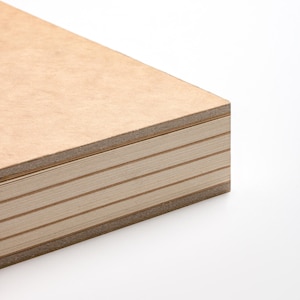 May include: Close-up of a stack of light brown plywood sheets. The edges reveal the layered construction, with alternating light and dark brown layers. The wood has a smooth, clean appearance, suggesting a focus on craftsmanship and quality.