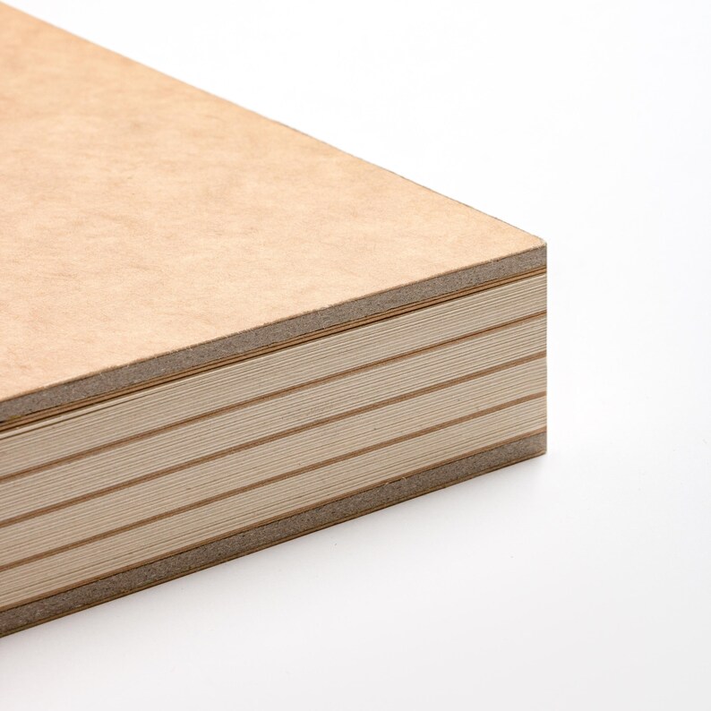 May include: Close-up of a stack of light brown plywood sheets. The edges reveal the layered construction, with alternating light and dark brown layers. The wood has a smooth, clean appearance, suggesting a focus on craftsmanship and quality.
