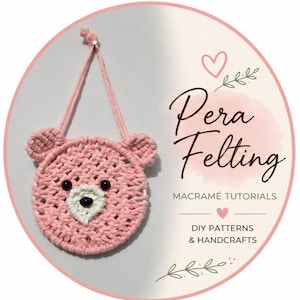 May include: A pink macrame bear-shaped ornament with black eyes and a white nose. The ornament has a hanging loop and is set against a white background within a pink circle. Text on the image reads "Pera Felting" and "Macrame Tutorials".