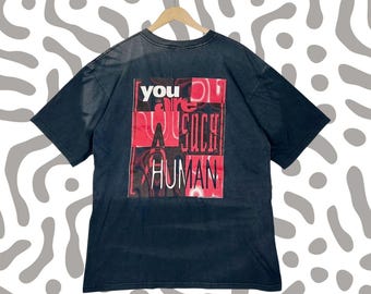Camiseta vintage de la película Hombres de Negro de 1997, con el gráfico "No eres humano", talla L