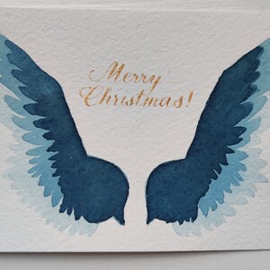 Carte de Noël Aquarelle Ailes Bleues Calligraphie Dorée