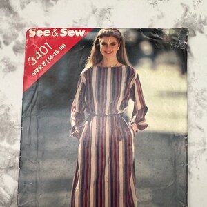 May include: Vintage sewing pattern envelope featuring a woman in a striped dress. The dress has vertical stripes in red, white, and blue. The envelope reads "See & Sew" and "3401 SIZE B (14-16-18)". The woman is wearing brown heels.