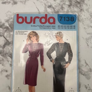 May include: Burda sewing pattern number 7138 for a dress with shoulder pads. The pattern includes two different styles: a burgundy dress with a lace neckline and a black dress with a lace overlay. The pattern includes sizes 38-48 and 12-20.
