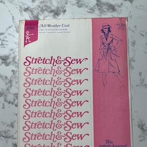 May include: A vintage sewing pattern for an all-weather coat. The pattern is designed for knit fabrics and is by Ann Person. The pattern number is 1080. The pattern is pink and white and features a line drawing of a woman wearing the coat.