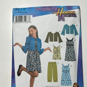 May include: A sewing pattern for girls' clothing featuring a blue jacket, a green jacket, a blue dress, a green dress, a green tank top, and green pants. The pattern is from Simplicity and features Hannah Montana. The pattern is for sizes 8-16.