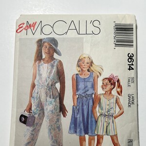 May include: A sewing pattern for girls' clothing. The pattern is for a jumpsuit, a skirt, and shorts. The pattern is from McCall's and is size large. The pattern number is 3614.