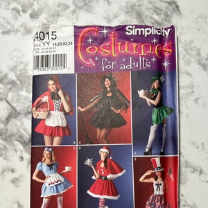 May include: A sewing pattern for five adult costumes. The pattern includes a red riding hood, a witch, a mad hatter, a alice in wonderland, and a santa claus costume. The pattern is from Simplicity and is for sizes YY 18, 20, 22, and 24.