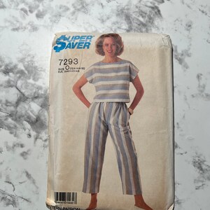 May include: A sewing pattern for a striped top and trousers. The pattern is for sizes 12-14-16 and the pattern number is 7293.