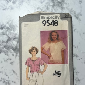 May include: Vintage Simplicity sewing pattern number 9548 for a Jiffy top. The pattern is for size 12, and the cover features two women wearing the top in different colors.