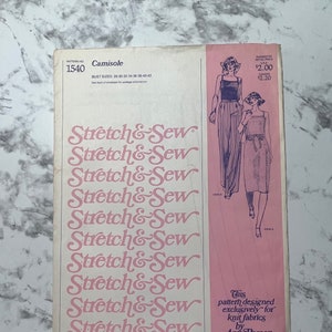 May include: A vintage sewing pattern for a camisole, featuring a pink background with the text "Stretch & Sew" repeated multiple times. The pattern is designed exclusively for knit fabrics by Ann Person. The pattern number is 1540 and the suggested retail price is $2.00.