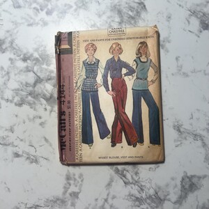 May include: Vintage McCall's 4144 sewing pattern for misses' blouse, vest, and pants. The pattern features illustrations of the garments on the front. The pattern is for unbonded stretchable knits. The pattern is in a brown paper envelope.