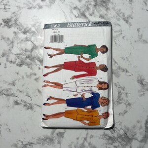May include: A Butterick sewing pattern featuring illustrations of women's suits in various colors: green, red, white, blue, and yellow. The pattern number is 3362, with sizes 18-20-22. The cover is white with black text and illustrations.