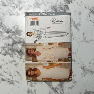 May include: A vintage sewing pattern for a dress and jacket. The pattern is for size 6-16 and is from the brand Butterick. The pattern is called Rimini and has a model wearing a white dress and jacket.