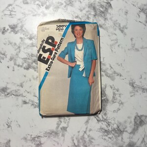 May include: A vintage Simplicity ESP Extra-Sure Pattern envelope featuring a woman in a teal skirt suit. The envelope has a blue diagonal stripe and the text "Simplicity ESP Extra-Sure Pattern". The price is $1.50.