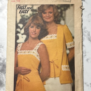 May include: Vintage sewing pattern for a yellow knit top with a lace trim and a matching skirt. The pattern is from the brand 'Duchess' and is labeled 'Fast and Easy'.