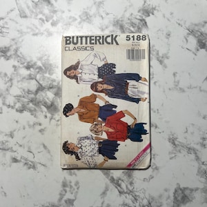 May include: A vintage Butterick Classics sewing pattern, model 5188, featuring illustrations of women's clothing designs. The cover displays a barcode and the text "Yes! It's Easy!" in pink. The pattern includes sizes 8-10-12.