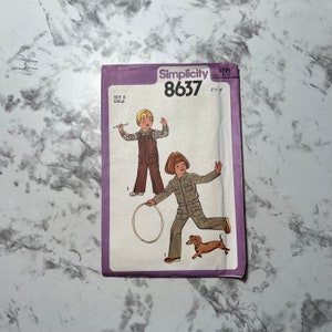 May include: Simplicity sewing pattern number 8637 for a child's jumpsuit and shirt. The pattern shows two children wearing the garments, one with a brown jumpsuit and a plaid shirt, and the other with a green jumpsuit. A dachshund dog is also pictured.