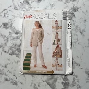 May include: A sewing pattern for a jacket and trousers. The pattern is for sizes 16-18-20-22. The pattern is called "Easy McCall's" and is part of the "Non-Stop Wardrobe" collection.