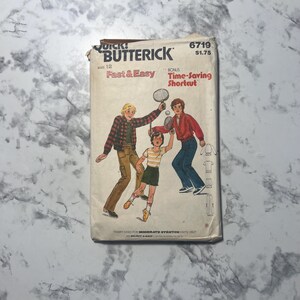 May include: Vintage Butterick sewing pattern, size 12, featuring a tennis-themed illustration. The cover displays the text "Fast & Easy" and "Time-Saving Shortcut". The pattern includes illustrations of clothing designs on the back.