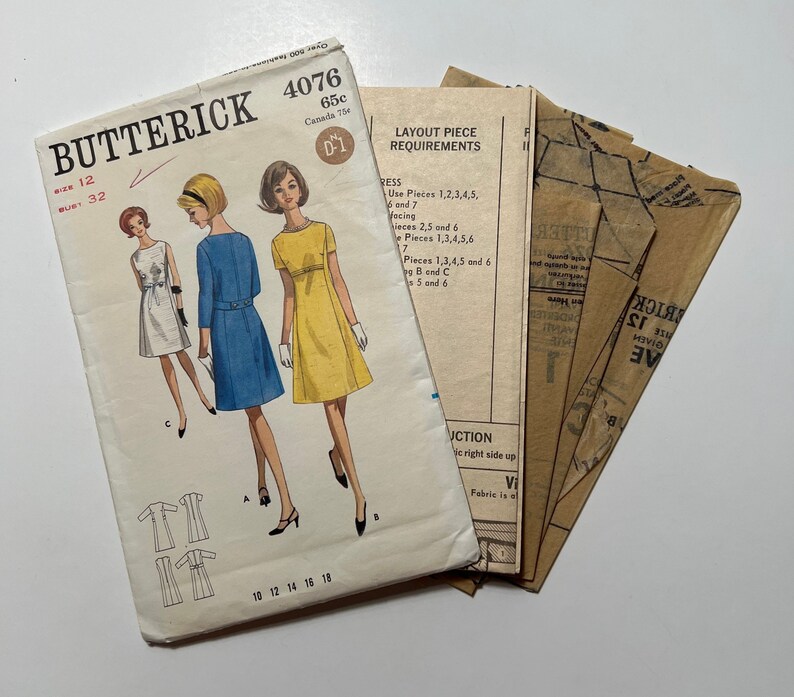 May include: Vintage sewing pattern for a dress, Butterick pattern number 4076, size 12, bust 32. The pattern includes instructions and layout pieces for the dress.