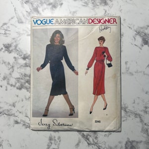 May include: Vogue American Designer pattern number 2245 for a dress by Jerry Silverman. The pattern shows two versions of the dress, one in black and one in red.
