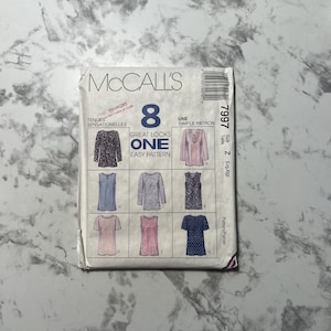 May include: McCall's sewing pattern envelope for a women's top. The pattern is called "Great Looks One Easy Pattern" and includes eight different styles. The pattern number is 7997 and the size is Z (Large/Extra Large).