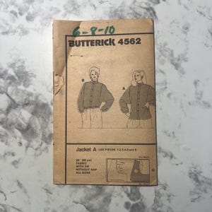 May include: A vintage Butterick 4562 sewing pattern. The pattern features illustrations of a jacket design, with the text "Jacket A" and fabric requirements. The pattern size is 6-8-10.