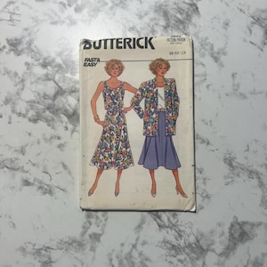 May include: A vintage Butterick sewing pattern featuring illustrations of a floral print dress and a matching jacket and skirt ensemble. The pattern includes the text "Fast & Easy" and the pattern number 3920.