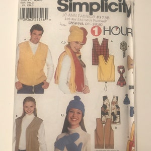 May include: A sewing pattern for a vest, hat, scarf, and mittens. The pattern is from Simplicity and is labeled "1 Hour".