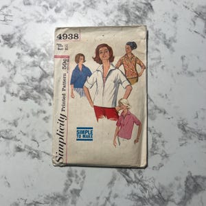 May include: Simplicity Printed Pattern 50c sewing pattern for a blouse. The pattern number is 4938, size 12, bust 32. The pattern shows three women wearing different versions of the blouse.