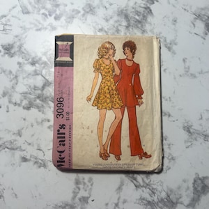 May include: Vintage McCall's sewing pattern for a young junior/teen dress or tunic, pants or dance pants. The pattern number is 3096 and the price is $1.00.