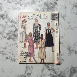 May include: Vintage McCall's sewing pattern featuring illustrations of various dress designs. The pattern packet includes the text "Easy McCall's", "Fashion Basics", and "Petite-Able". The size is 12.