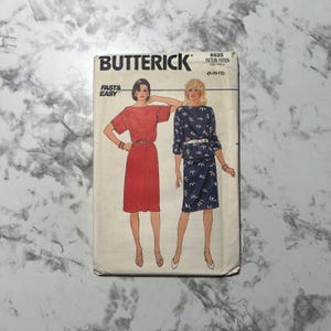 May include: Vintage Butterick sewing pattern featuring illustrations of two dresses. The pattern cover has the brand name "Butterick" and the text "Fast & Easy". The pattern number is 6525, with size information (8-10-12).