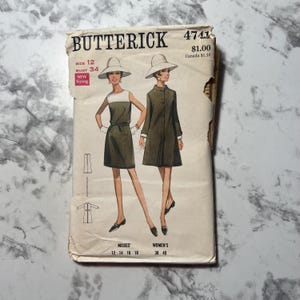 May include: Vintage sewing pattern for a dress, Butterick 4741, with a price tag of $1.00. The pattern is for misses sizes 12-18 and women's sizes 38-40.