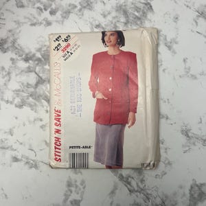 May include: A vintage McCall's sewing pattern featuring a woman in a red jacket and gray skirt. The pattern is labeled "Stitch 'N Save" and includes size information. The pattern is for Petite-Able sizes.