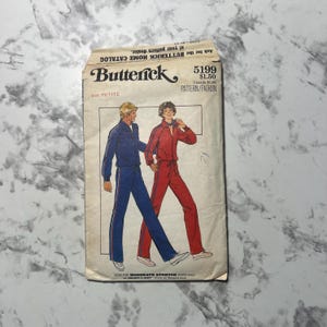 May include: Vintage Butterick pattern 5199, featuring illustrations of a blue and red tracksuit. The pattern is labeled "Size Petite" and includes text about the pattern and the Butterick Home Catalog.